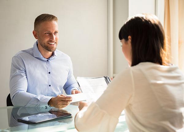 Man and a woman discussing job placement opportunities